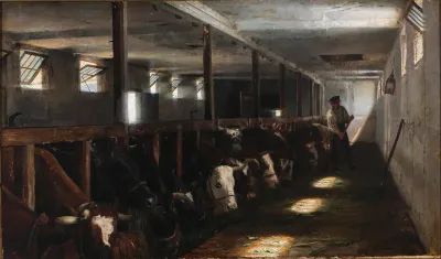 Stable interior with a farmer and his cows