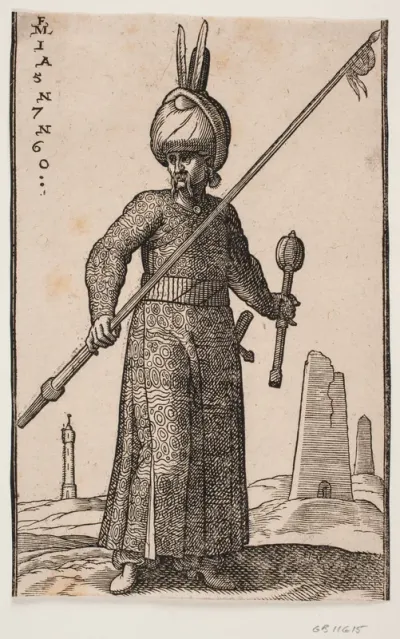 Stående soldat, skildret frontalt; i højre hånd en lanse med en vimpel på spidsen, i venstre en kølle og på hovedet en turban med to fjer; i baggrunden et "fyrtårn" samt to obelisk-lignende bygninger