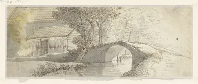 Stenen brug bij een groep huizen