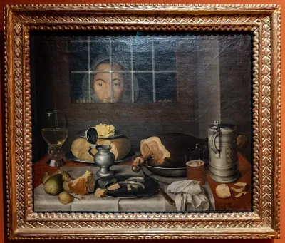 Still Life at Meal Time with kitchen maid behind the window