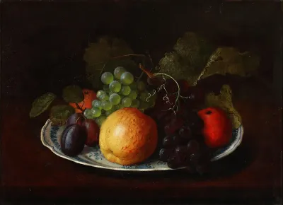 Still life with apples, plums, and grapes on an earthenware dish