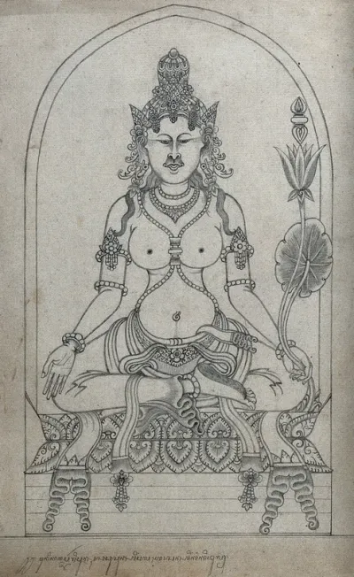 Temple sculpture: a seated figure holding a lotus flower