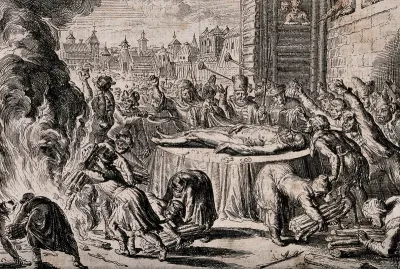 The body of an old man is laid out naked in state outside the wooden fortifications of a town and mocked and insulted by a mob lighting a bonfire