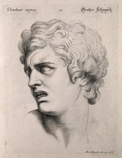 The face of a man suffering great pain