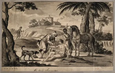 The good Samaritan stopping to help treat a wounded man