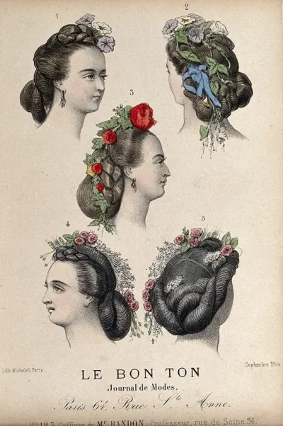 The heads of five women with braided hair dressed with flowers