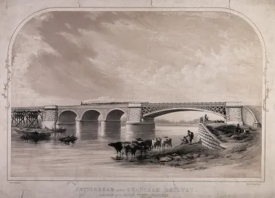 The Radcliffe Viaduct, Radcliffe on Trent, Nottinghamshire: a locomotive passing over the River Trent, and cattle drinking in the river
