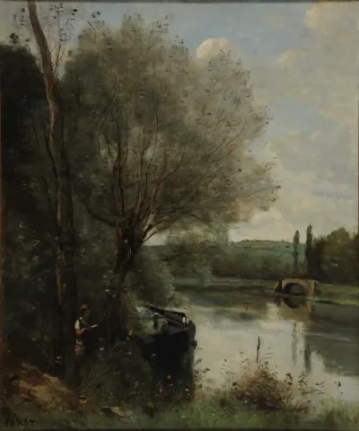 The reader by the wooded bank