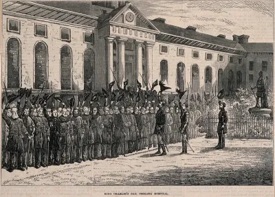 The Royal Hospital, Chelsea: view of the Pensioners cheering and waving their hats and sticks, at a King Charles's Day Parade