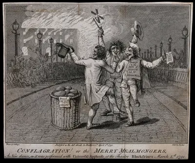 Three men dance in the street as a crowd gathers on Blackfriars Bridge, London, to celebrate the destruction by fire of Albion Mills