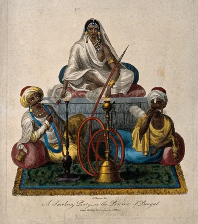 Three wealthy Indians sit smoking hookas and a cigar