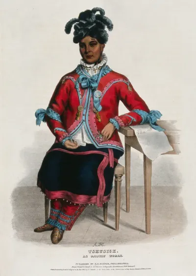 Tshusick, an Ojibwa woman, holding a flower