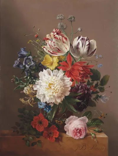 Tulips, roses, peonies and other flowers in a vase on a stone ledge