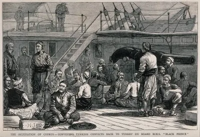 Turkish prisoners from Cyprus being transported to Turkey, on board a ship with a guard watching them from the rail