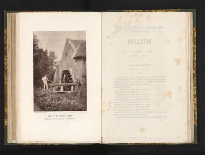 Twee mannen regelen het waterpeil bij een watermolen, te Eijsden