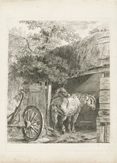 Twee paarden in een boerenschuur