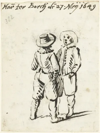 Twee staande jongemannen in gesprek