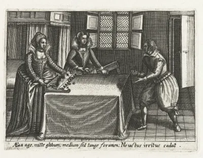 Twee vrouwen en een man spelen een balspel op tafel
