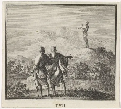 Twee wandelaars kijken naar een man op een heuvel