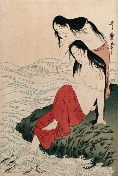 Two amas (women divers) on shore watching fish in the water
