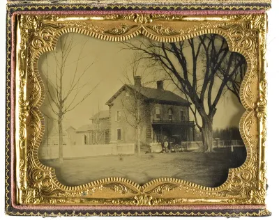 Two and a Half Story Brick Country House with Outbuildings with Ornate Porch and Picket Fence