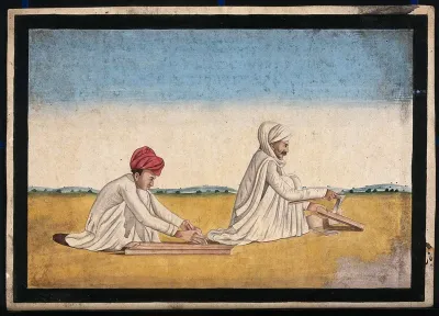Two carpenters, possibly father and son, at work