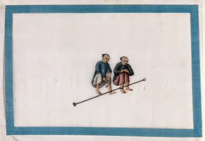 Two Chinese prisoners with their ankles bound to a metal bar, squat on the ground