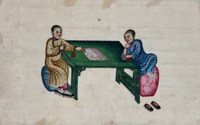 Two Chinese women play a board game