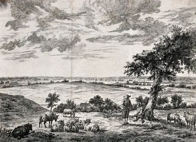 Two goatherds sit under a tree while their flock graze on the hillside