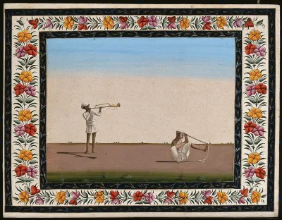 Two Indian men: (left) blowing a trumpet-like instrument and (right) an armless man tying a turban on his head with his feet