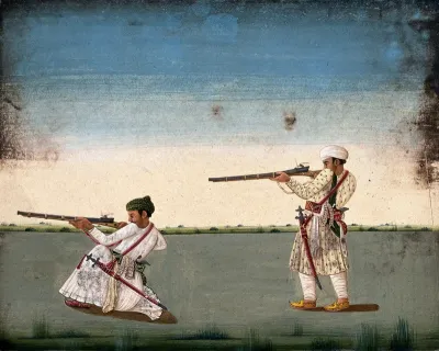 Two Indian soldiers (?) take aim and fire their rifles
