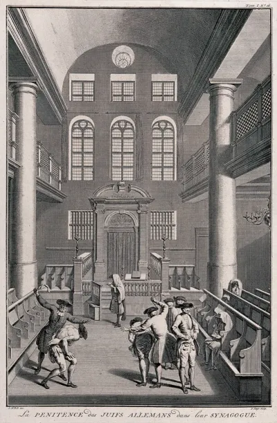 Two Jews in a synagogue are stripped to the waist and flogged with leather straps while others have assembled for religious observance