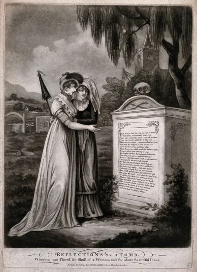 Two ladies contemplate a tombstone