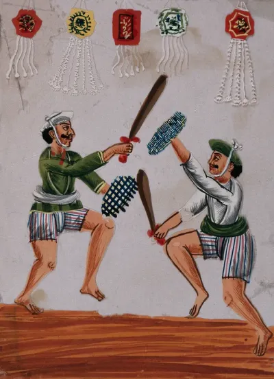 Two men engaged in a mock duel as part of the festivities