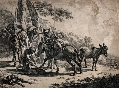 Two men on a journey with three donkeys along a path through rocky terrain: one of the men is tending to the shoes of a donkey as the other man looks on