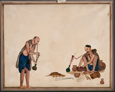 Two men preparing and smoking opium