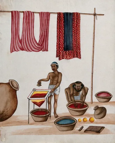Two men preparing dye for fabric