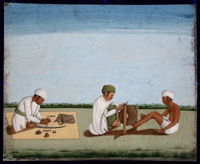 Two men sharpening a knife whilst the third prepares the blade on a sword