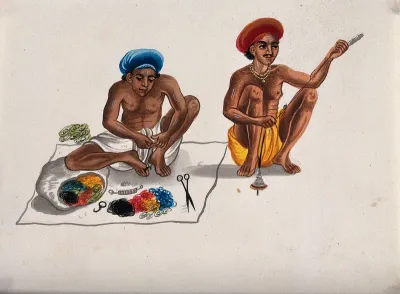 Two men spinning thread using a spindle