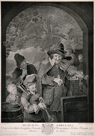 Two musicians play their instruments in a doorway to amuse the passers-by