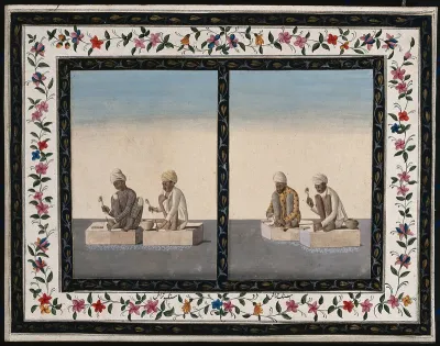 Two pairs of stonemasons working with a chisel and hammer
