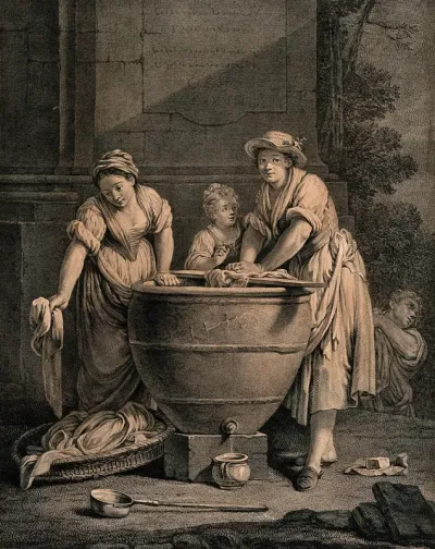 Two women accompanied by a child are washing clothes in a large vessel