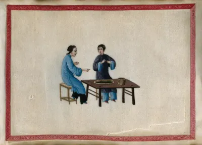 Two women grading (?) tea