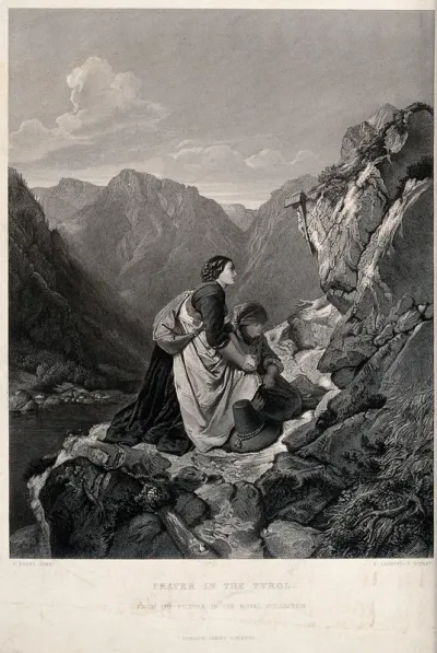 Two women praying before a crucifix in the mountains