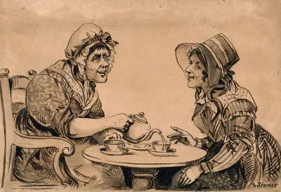 Two women taking tea at a small round table