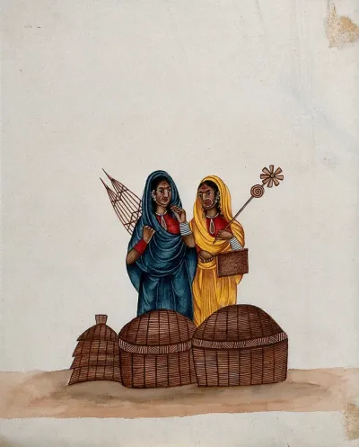 Two women with large nose rings wearing bright saris standing next to some baskets