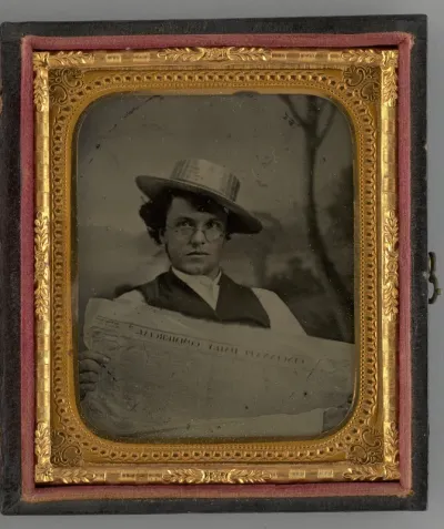 Untitled (Portrait of a Man Holding a Newspaper and Wearing a Straw Hat)