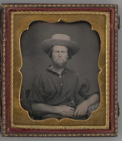 Untitled (Portrait of a Man Wearing a Straw Hat)