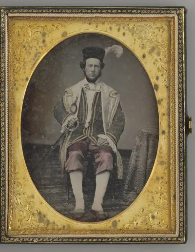 Untitled (Portrait of Seated Man, Wearing a Hat with a Feather)