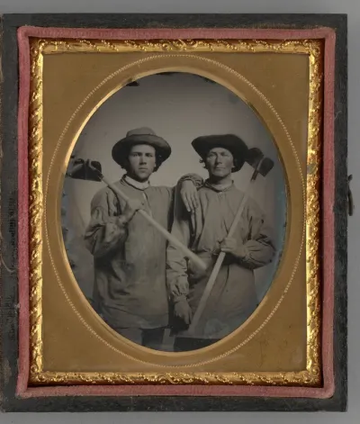 Untitled (Portrait of Two Men Holding Shovels)